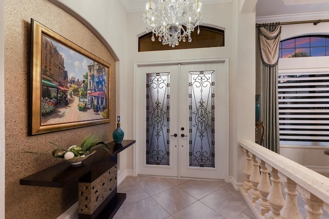 5804 Mulligan Way, Lakewood Ranch, FL 34211 - tiled entryway featuring ornamental molding, a chandelier, french doors, and arched walkways
