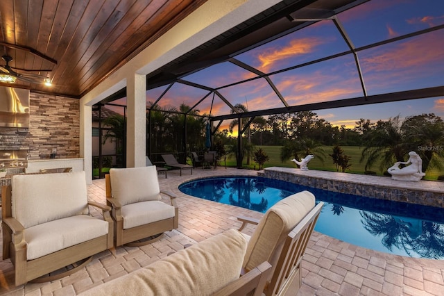 5804 Mulligan Way, Lakewood Ranch, FL 34211 - swimming pool with a patio, exterior kitchen, and a lanai