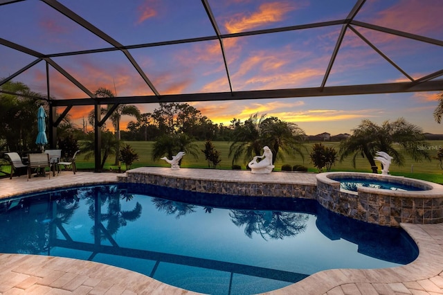 5804 Mulligan Way, Lakewood Ranch, FL 34211 - pool at dusk featuring a patio, a lanai, and a pool with connected hot tub