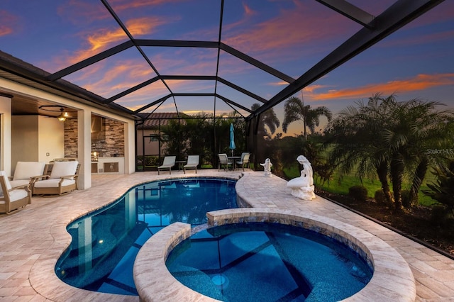 5804 Mulligan Way, Lakewood Ranch, FL 34211 - view of swimming pool featuring a patio area, a pool with connected hot tub, and glass enclosure