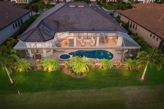 5804 Mulligan Way, Lakewood Ranch, FL 34211 - rear view of house featuring a patio, a lawn, and a pool with connected hot tub