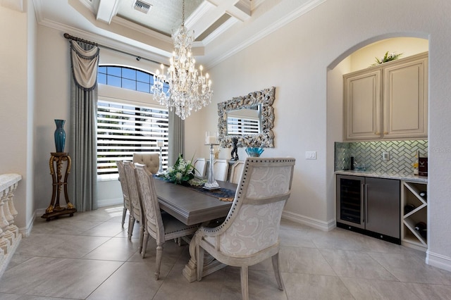 5804 Mulligan Way, Lakewood Ranch, FL 34211 - dining space with ornamental molding, a chandelier, light tile patterned floors, wine cooler, and coffered ceiling