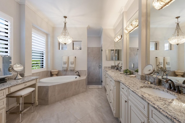 5804 Mulligan Way, Lakewood Ranch, FL 34211 - bathroom with a chandelier, a garden tub, vanity, a shower stall, and ornamental molding