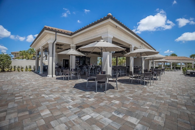 5804 Mulligan Way, Lakewood Ranch, FL 34211 - view of patio with outdoor dining space, a ceiling fan, and a gazebo
