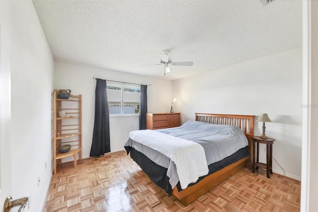 4107 Brittany Ln Unit 18, Sarasota, FL 34233 - bedroom featuring a textured ceiling and a ceiling fan