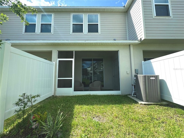 6253 Whetstone Ct, Palmetto, FL 34221 - rear view of property with a sunroom and stucco siding