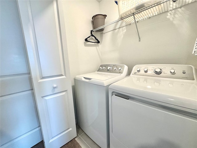 6253 Whetstone Ct, Palmetto, FL 34221 - washroom with washing machine and dryer and tile patterned floors