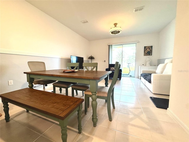 6253 Whetstone Ct, Palmetto, FL 34221 - dining area featuring light tile patterned floors, vaulted ceiling, and an office area