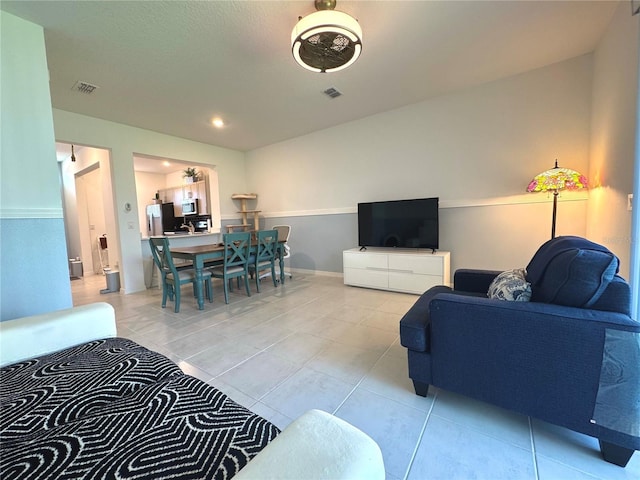 6253 Whetstone Ct, Palmetto, FL 34221 - tiled living room featuring baseboards