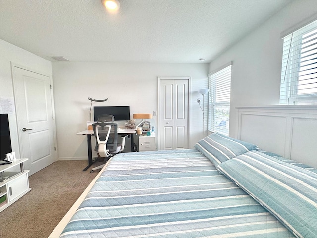 6253 Whetstone Ct, Palmetto, FL 34221 - carpeted bedroom featuring a textured ceiling, a closet, and an office area