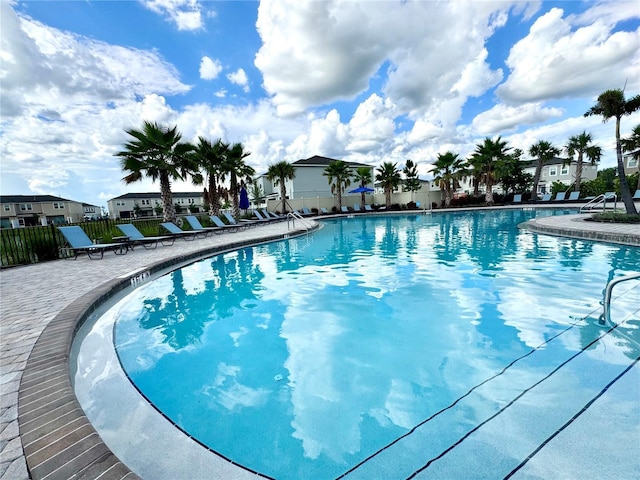 6253 Whetstone Ct, Palmetto, FL 34221 - community pool featuring a residential view and a patio area