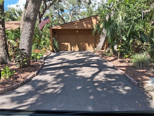 2411 Quail Ct, Bradenton, FL 34209 - view of home's exterior with asphalt driveway and a garage