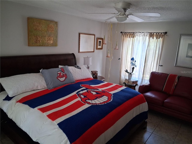 2411 Quail Ct, Bradenton, FL 34209 - bedroom with tile patterned flooring, a textured ceiling, and ceiling fan