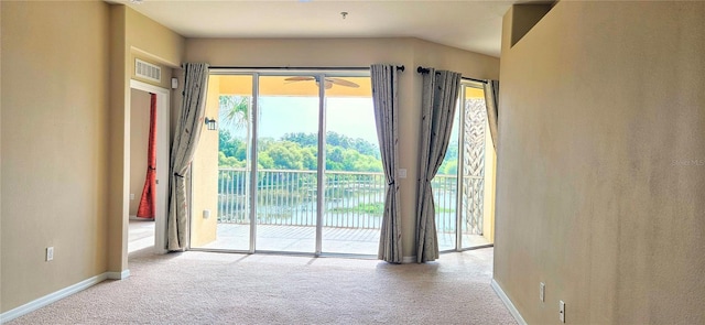 1251 Burgos Dr Unit 303, Sarasota, FL 34238 - doorway to outside with carpet floors and ceiling fan