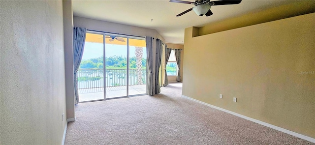 1251 Burgos Dr Unit 303, Sarasota, FL 34238 - carpeted spare room featuring ceiling fan, a textured wall, and a water view