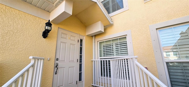 1251 Burgos Dr Unit 303, Sarasota, FL 34238 - property entrance with stucco siding