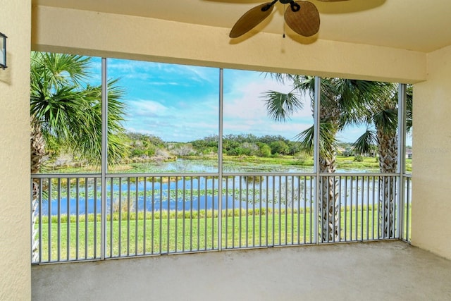 1251 Burgos Dr Unit 303, Sarasota, FL 34238 - unfurnished sunroom featuring a water view