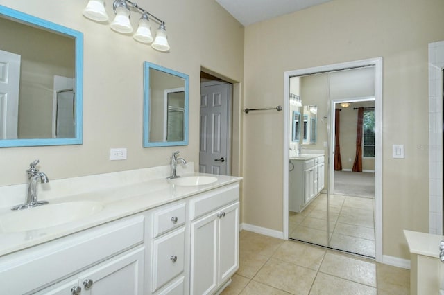 1251 Burgos Dr Unit 303, Sarasota, FL 34238 - full bathroom featuring double vanity and tile patterned floors