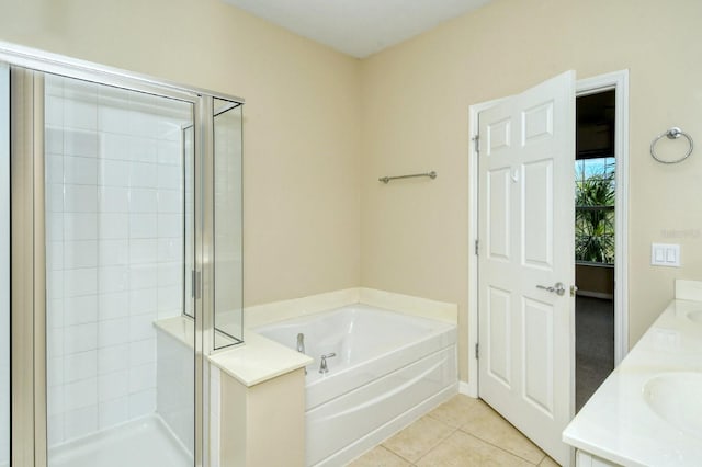 1251 Burgos Dr Unit 303, Sarasota, FL 34238 - full bathroom with a stall shower, a garden tub, tile patterned floors, and double vanity