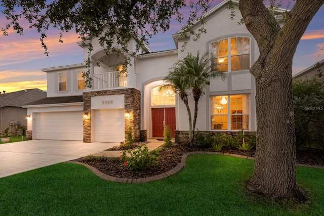 4410 67th Avenue Cir E, Sarasota, FL 34243 - view of front facade featuring stucco siding, a balcony, and stone siding