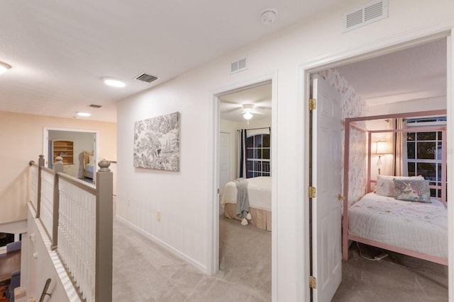 4410 67th Avenue Cir E, Sarasota, FL 34243 - hallway featuring light colored carpet and baseboards