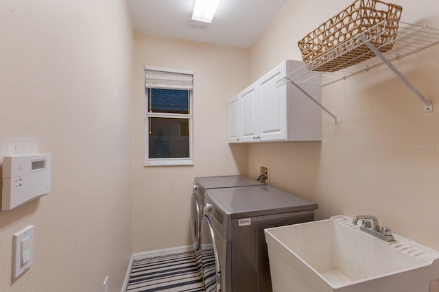 4410 67th Avenue Cir E, Sarasota, FL 34243 - laundry area with washer and dryer, cabinet space, and carpet floors