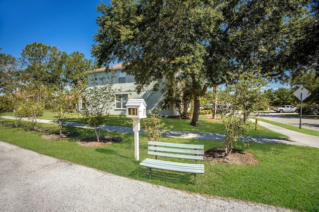 4410 67th Avenue Cir E, Sarasota, FL 34243 - view of front of house featuring a front lawn and stucco siding