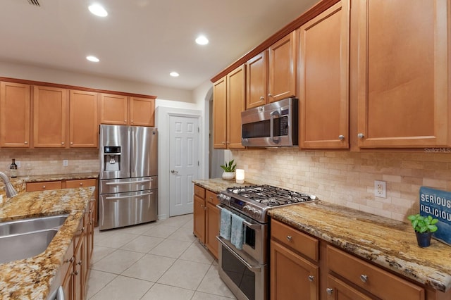 4410 67th Avenue Cir E, Sarasota, FL 34243 - kitchen featuring stainless steel appliances, light tile patterned flooring, light stone countertops, backsplash, and recessed lighting