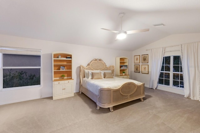 4410 67th Avenue Cir E, Sarasota, FL 34243 - bedroom with light carpet, lofted ceiling, and a ceiling fan