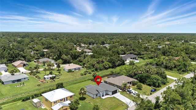 2692 Pretzel Ln, North Port, FL 34286 - aerial view of residential area with a heavily wooded area