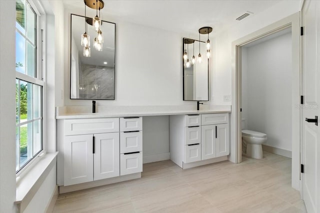 2692 Pretzel Ln, North Port, FL 34286 - bathroom featuring double vanity and a shower