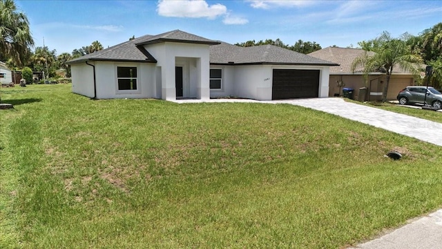 2692 Pretzel Ln, North Port, FL 34286 - prairie-style house with stucco siding, a garage, a front yard, decorative driveway, and a shingled roof