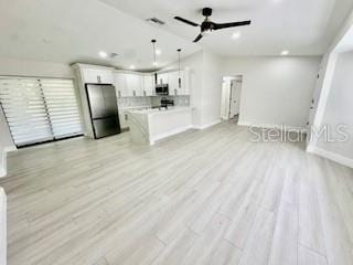 5009 Jody Ave, North Port, FL 34288 - unfurnished living room featuring recessed lighting, light wood-style floors, and ceiling fan