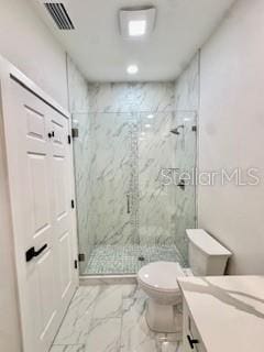 5009 Jody Ave, North Port, FL 34288 - bathroom featuring vanity, a marble finish shower, and marble look tile flooring