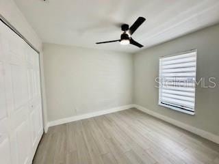 5009 Jody Ave, North Port, FL 34288 - unfurnished bedroom featuring wood finished floors, a closet, and a ceiling fan