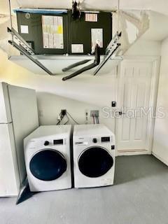 5009 Jody Ave, North Port, FL 34288 - laundry area with washing machine and clothes dryer