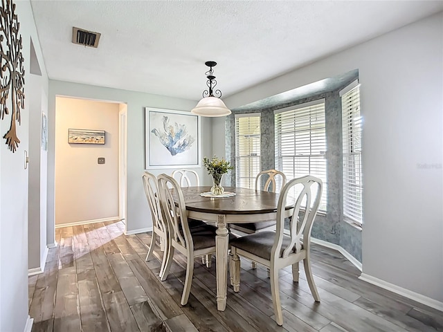 408 67th Ave W, Bradenton, FL 34207 - dining space featuring wood finished floors and plenty of natural light