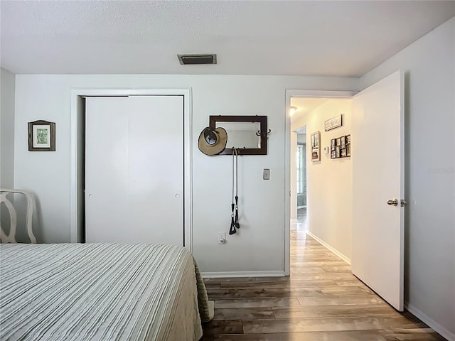 408 67th Ave W, Bradenton, FL 34207 - bedroom featuring light wood-type flooring and a closet