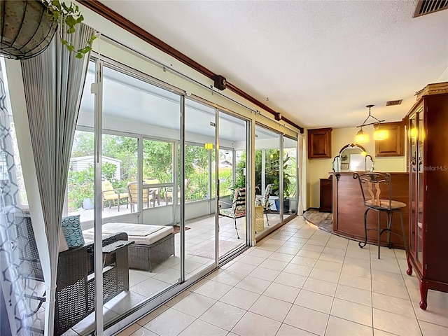 408 67th Ave W, Bradenton, FL 34207 - doorway with healthy amount of natural light and light tile patterned floors