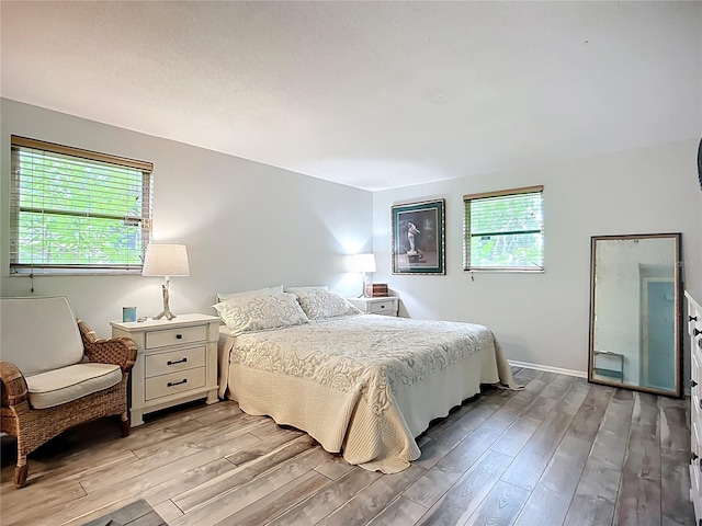 408 67th Ave W, Bradenton, FL 34207 - bedroom featuring light wood-style flooring and baseboards