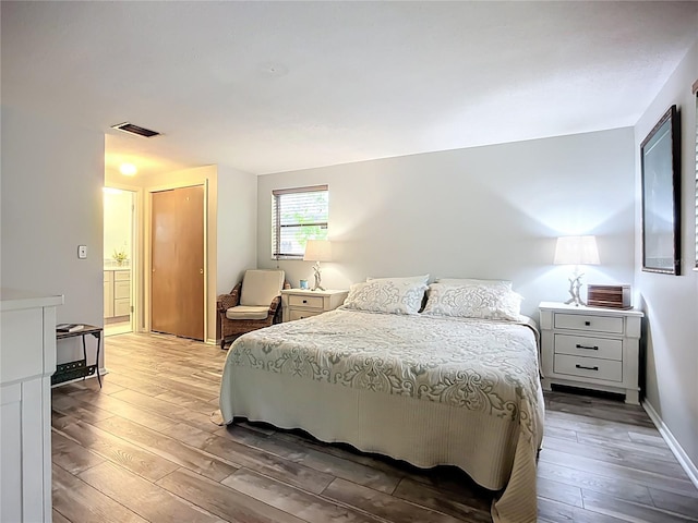 408 67th Ave W, Bradenton, FL 34207 - bedroom with light wood finished floors and a closet