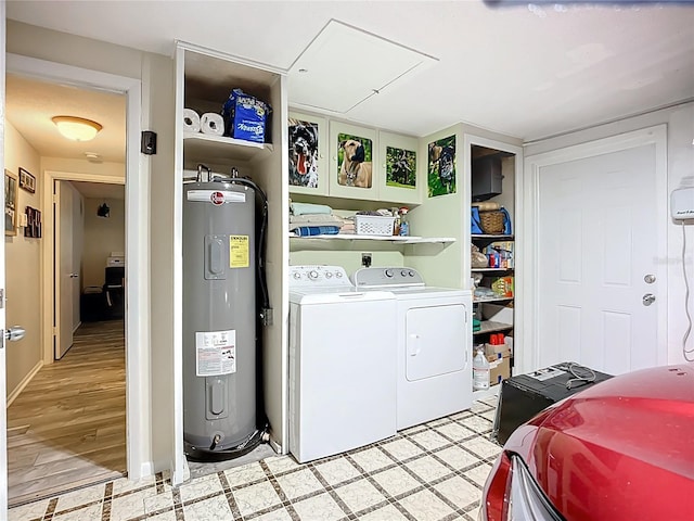 408 67th Ave W, Bradenton, FL 34207 - laundry area with electric water heater, washer and clothes dryer, and light floors