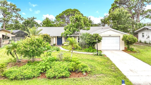 408 67th Ave W, Bradenton, FL 34207 - view of front of property with a garage, a front lawn, and concrete driveway