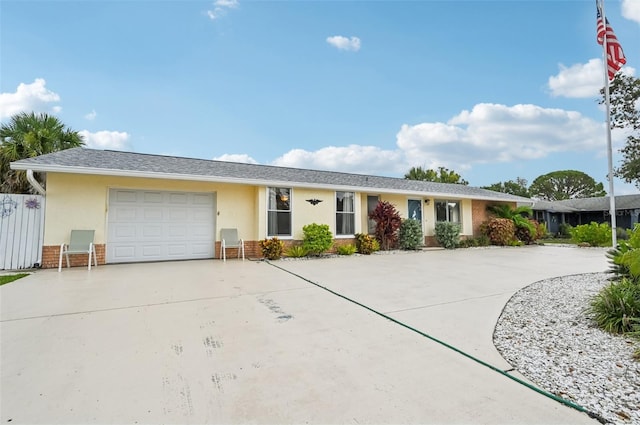 6002 34th Ave W, Bradenton, FL 34209 - single story home with driveway, an attached garage, stucco siding, and brick siding