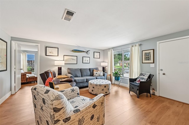 6002 34th Ave W, Bradenton, FL 34209 - living room with light wood finished floors and baseboards