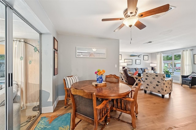 6002 34th Ave W, Bradenton, FL 34209 - dining area with light wood-style floors and a ceiling fan
