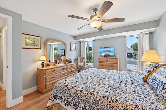 6002 34th Ave W, Bradenton, FL 34209 - bedroom featuring light wood finished floors, multiple windows, and ceiling fan