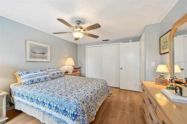 6002 34th Ave W, Bradenton, FL 34209 - bedroom featuring light wood-style floors, a closet, and a ceiling fan