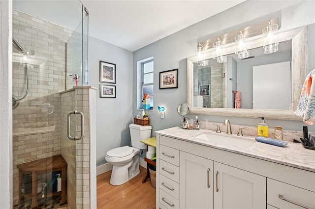6002 34th Ave W, Bradenton, FL 34209 - bathroom with wood finished floors, vanity, and a shower stall