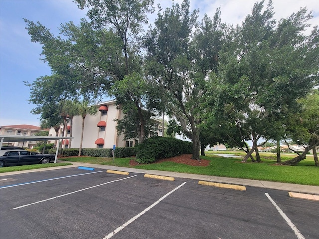 6507 Stone River Rd Unit 302, Bradenton, FL 34203 - view of uncovered parking lot